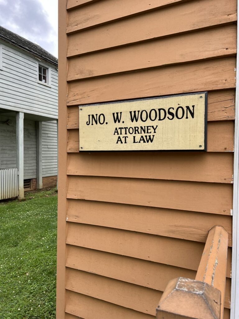 The nameplate on the Woodson Law Office.