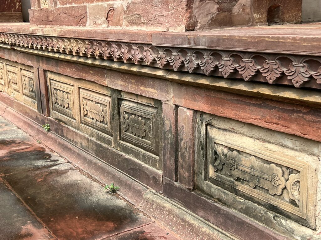 The red sandstone platform holding up the tomb